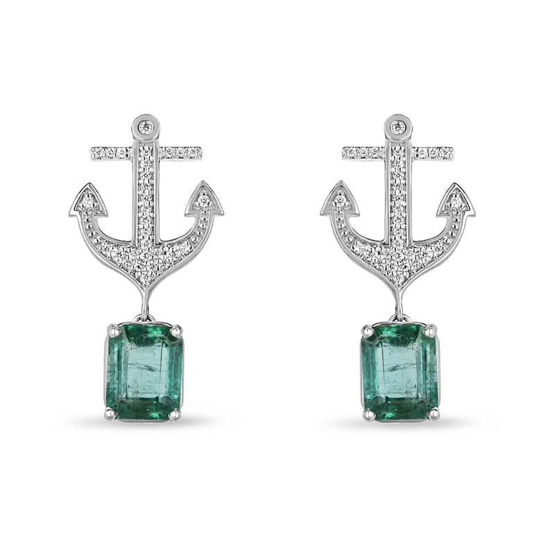 14K yellow gold emerald and diamond anchor dangle earrings featuring lush green Colombian emeralds and sparkling diamonds.
