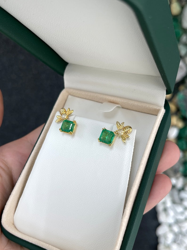 14K gold emerald Asscher cut bee ear climber earrings with 3.65tcw Colombian emeralds, featuring unique and stylish design.