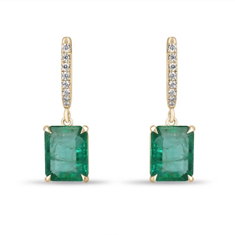 14K gold earrings with emerald cut green emeralds and diamond accents on huggie dangle hoops
