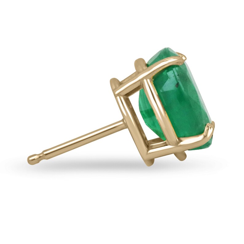 Colombian Emerald earrings with 4.85tcw 18K gold, vivid dark green oval cut emeralds in four-prong claw settings.