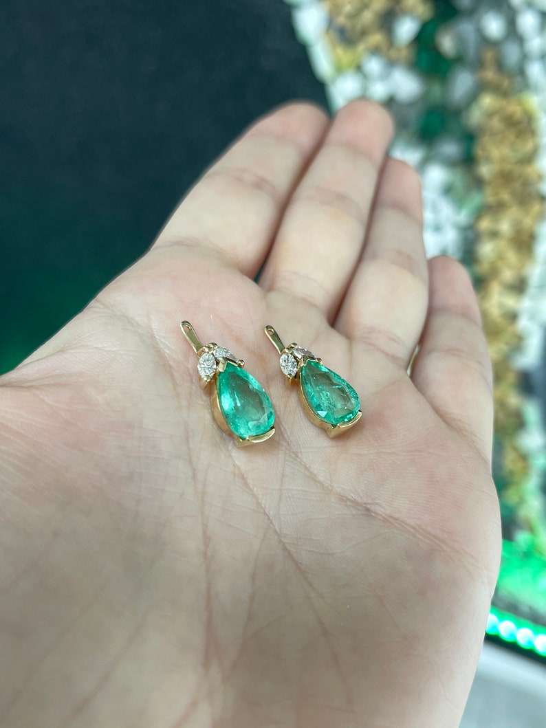 Colombian Emerald 7.97tcw 18K gold pear-cut green teardrop emerald and marquise diamond floral earring jackets, detailed design.