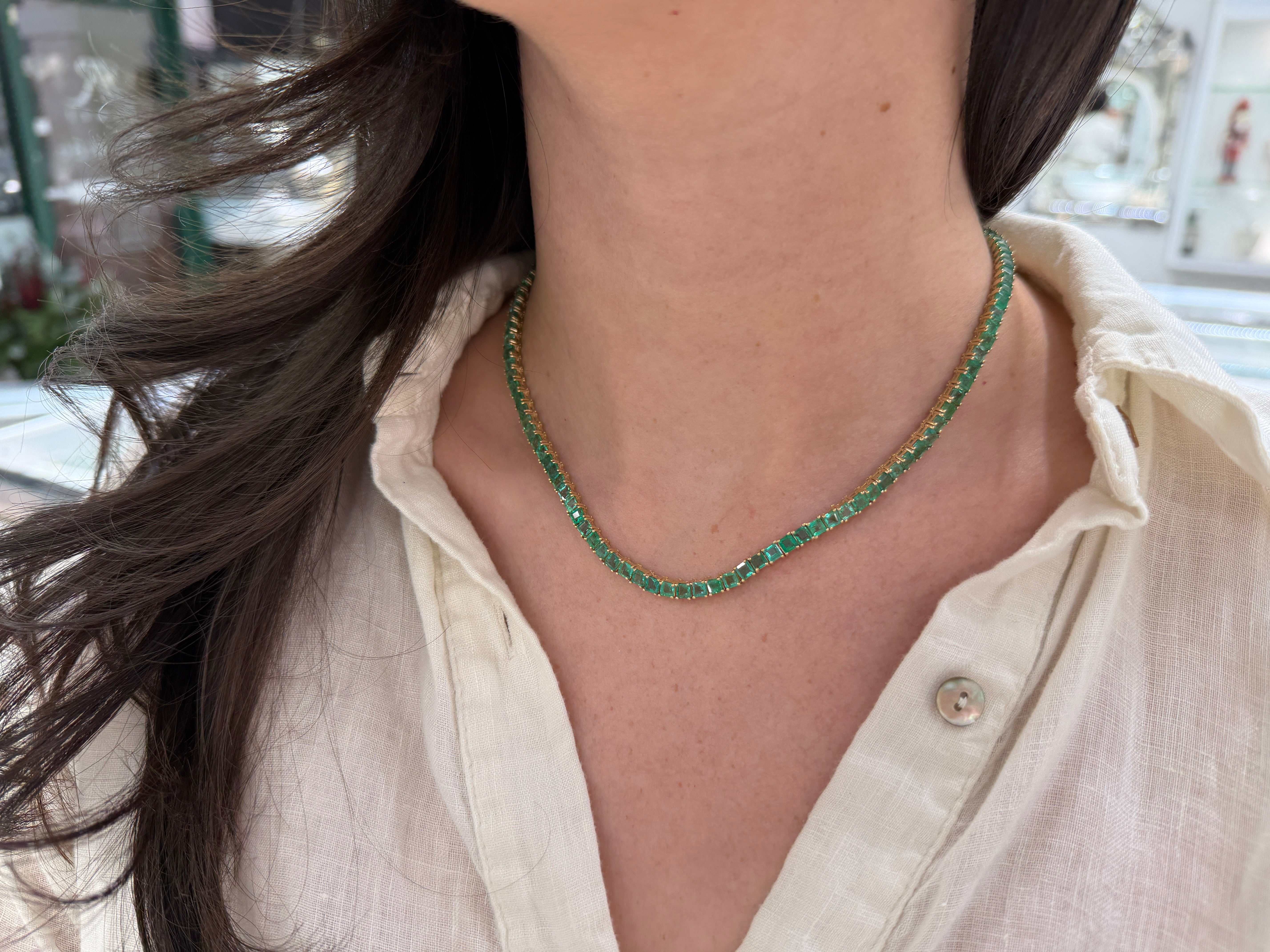 Colombian Emerald 19-inch adjustable princess cut necklace in 14K gold featuring a striking emerald pendant.