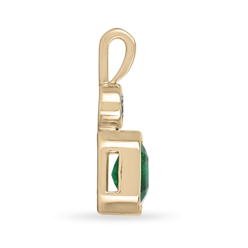 Dark green emerald pendant with round cut diamonds in 14K gold, featuring Colombian emerald and east-west design.