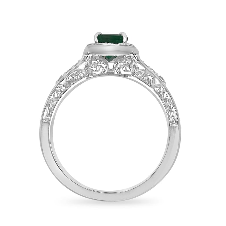 Vintage-inspired floral emerald cut engagement ring with diamond accents in 14K gold by Colombian Emerald, showcasing intricate design.