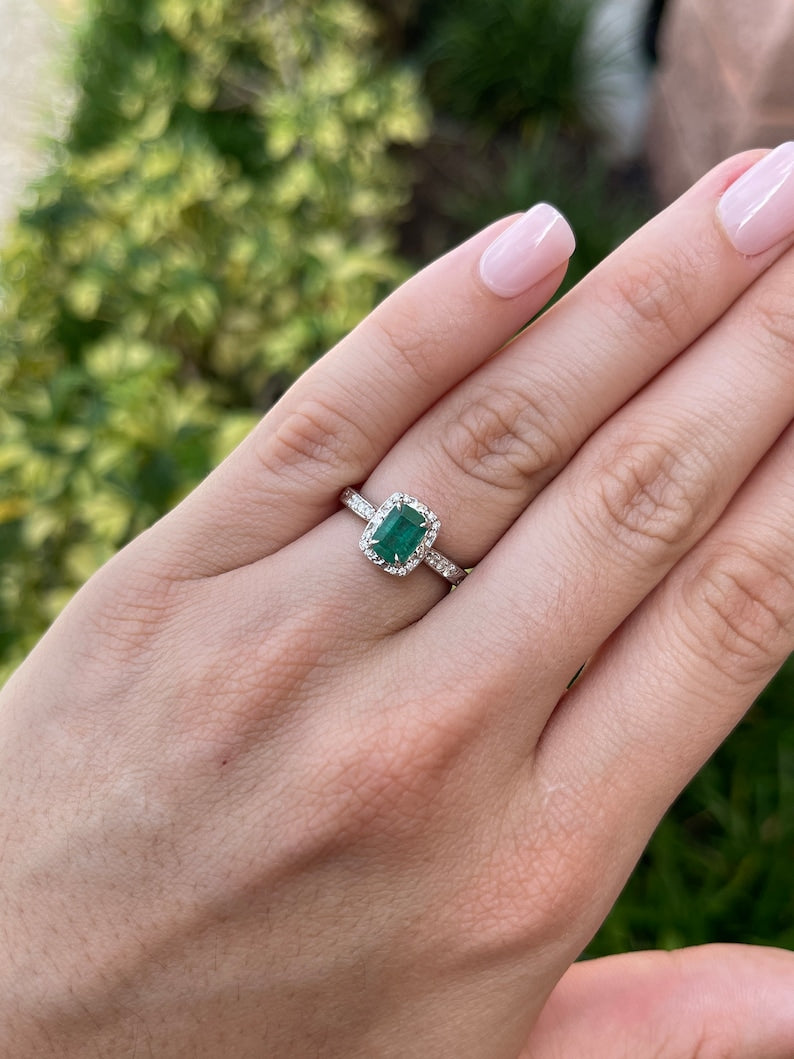 Vintage-inspired emerald cut engagement ring with floral accents, diamond details, set in 14K gold by Colombian Emerald.