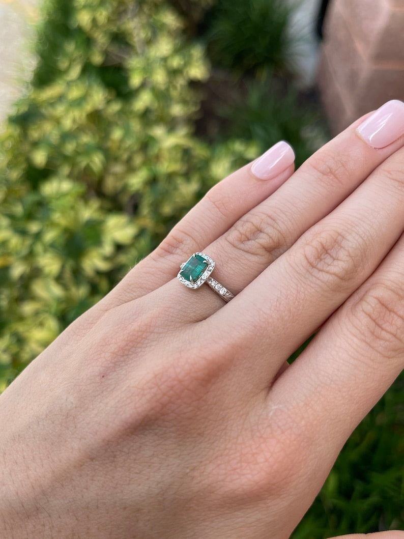 Vintage-inspired emerald cut engagement ring with floral design, diamond accents, 14K gold from Colombian Emerald.