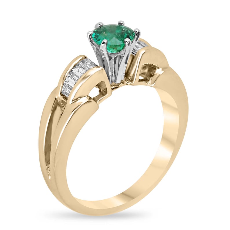 14K gold engagement ring with 1.25tcw round Colombian emerald and diamond baguette accents in a six-prong setting.