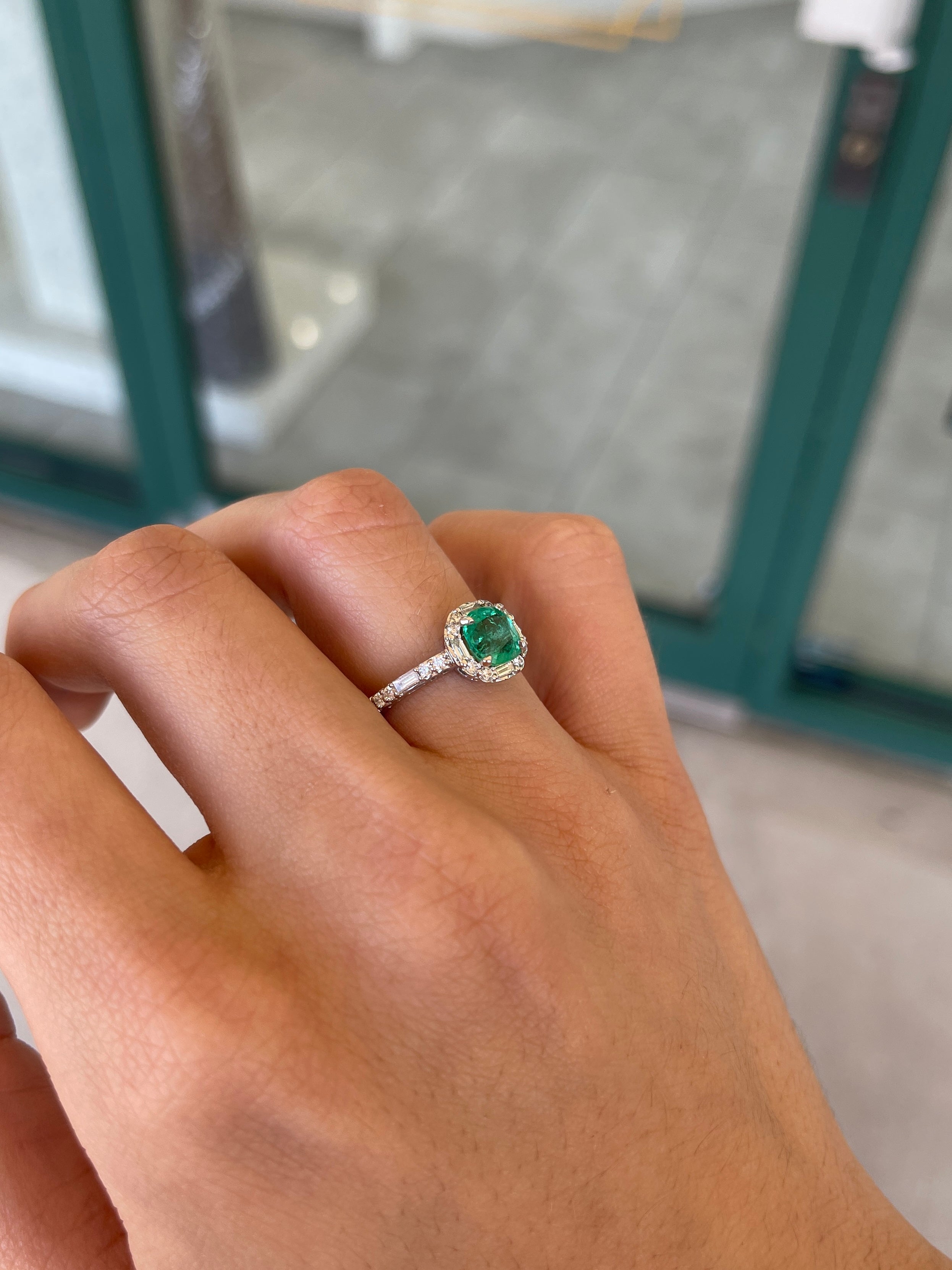 14K Vivid Green Emerald engagement ring with diamond halo, cushion cut emerald, and baguette diamonds from Colombian Emerald.