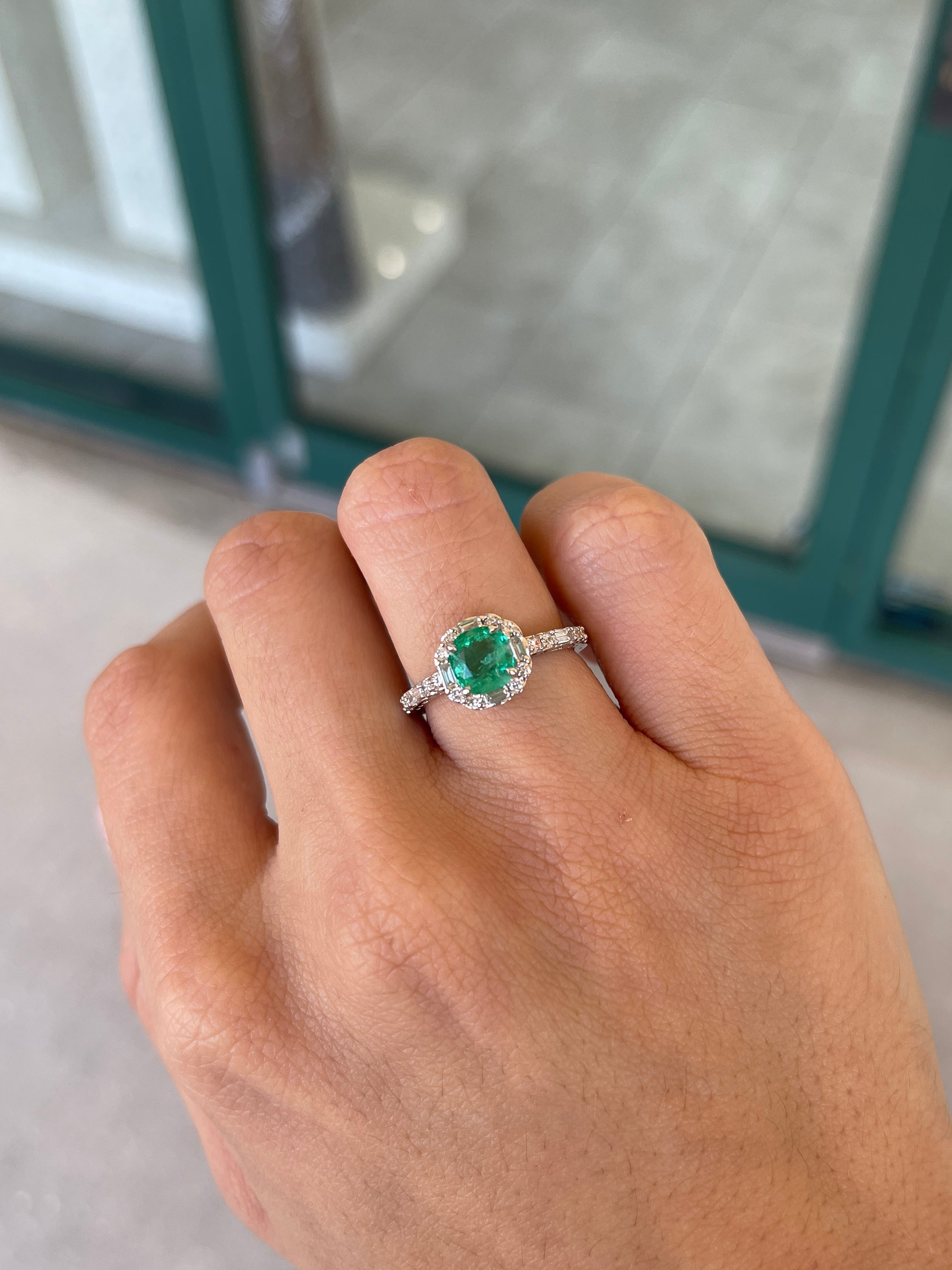 Vivid green emerald engagement ring with cushion cut emerald and diamond halo, 14K gold from Colombian Emerald.