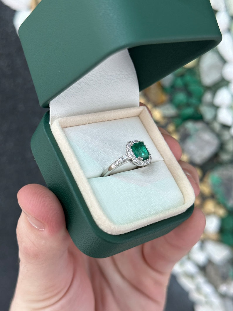 High-quality Zambian emerald cut emerald and diamond halo engagement ring in 14K gold by Colombian Emerald