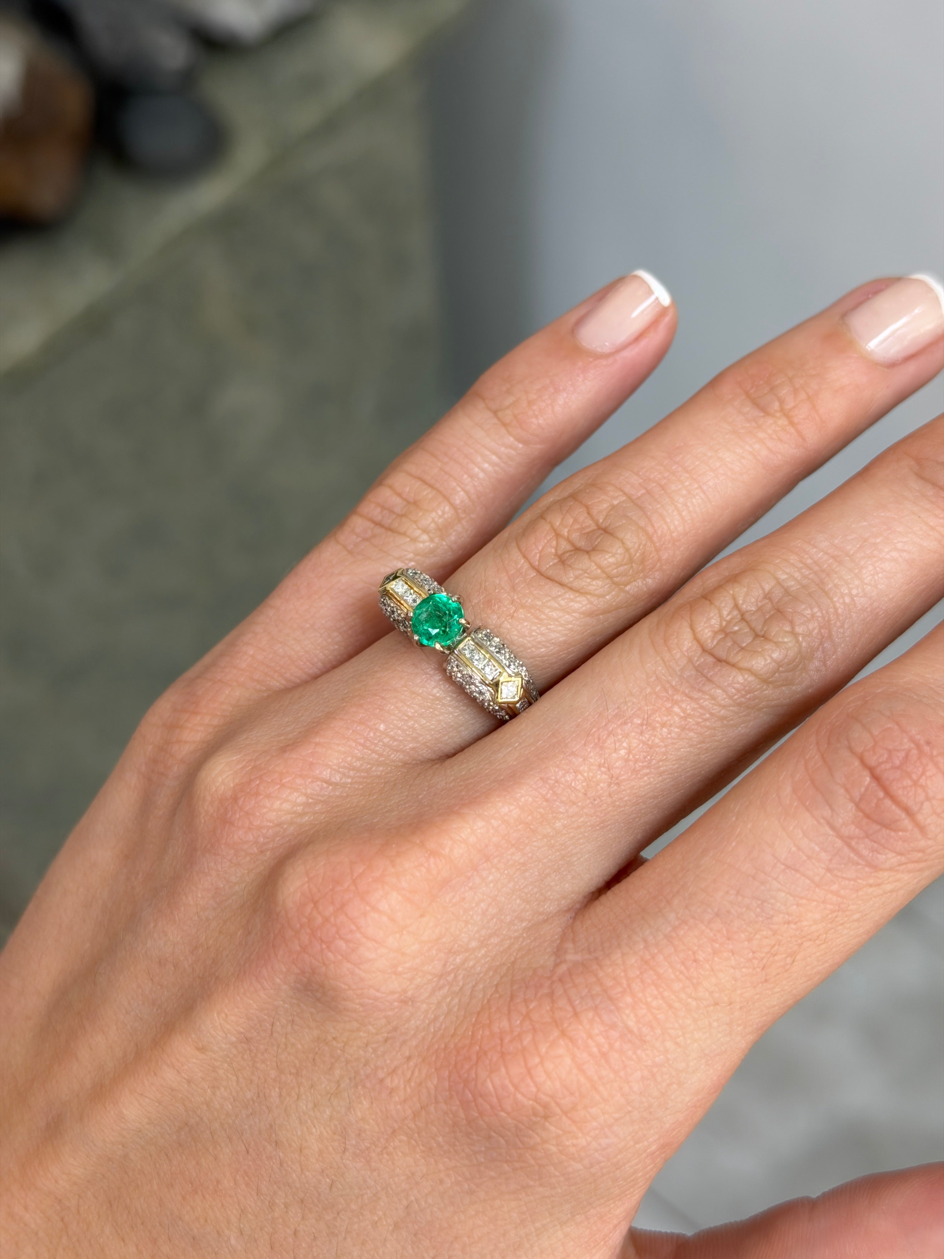 18K gold engagement ring featuring a 1.85tcw round cut Colombian emerald with diamond accents, elegant and vibrant jewelry piece.