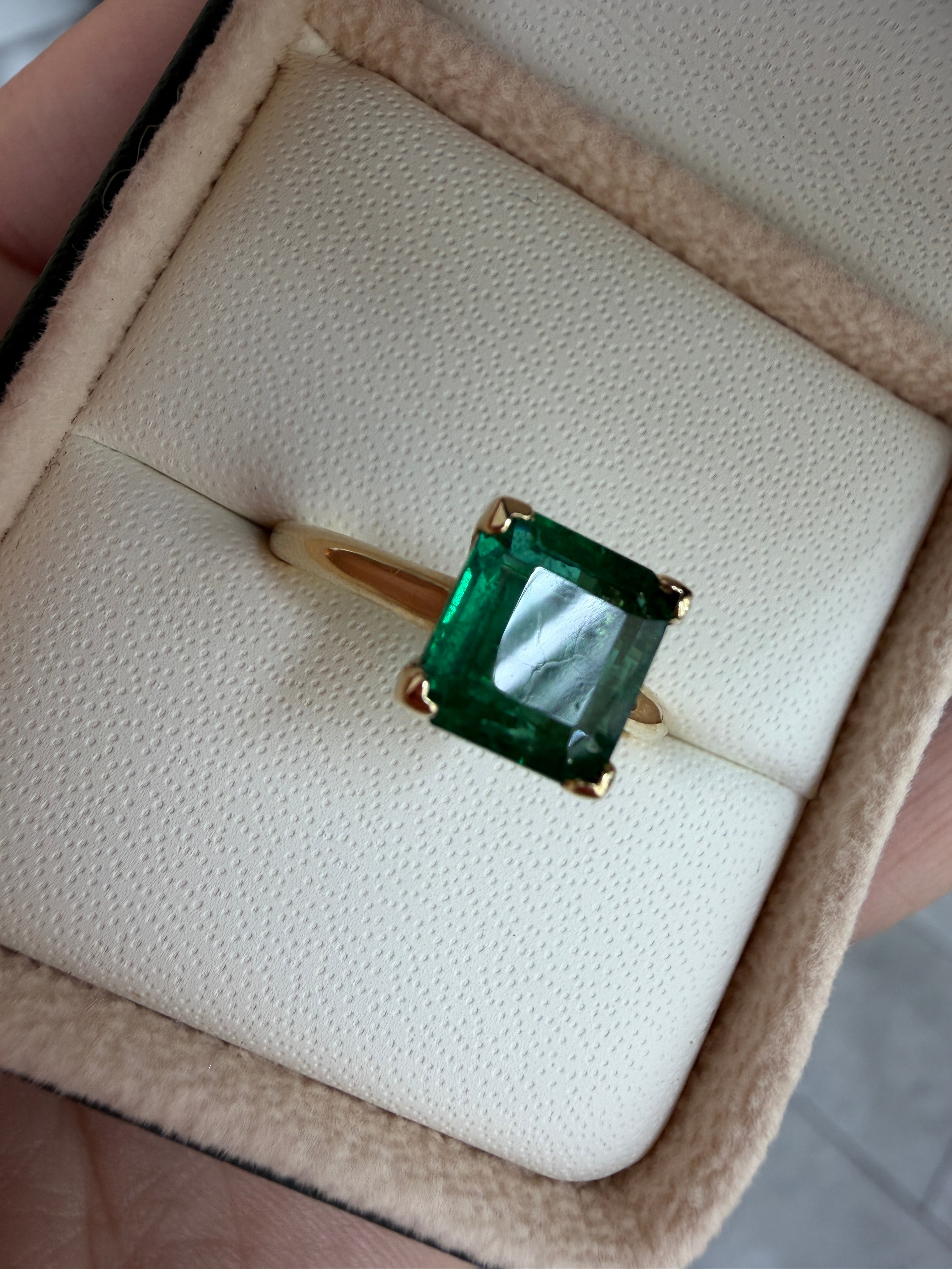 Deep green 1.99ct Asscher cut emerald solitaire engagement ring with V prong setting in 14K gold by Colombian Emerald.