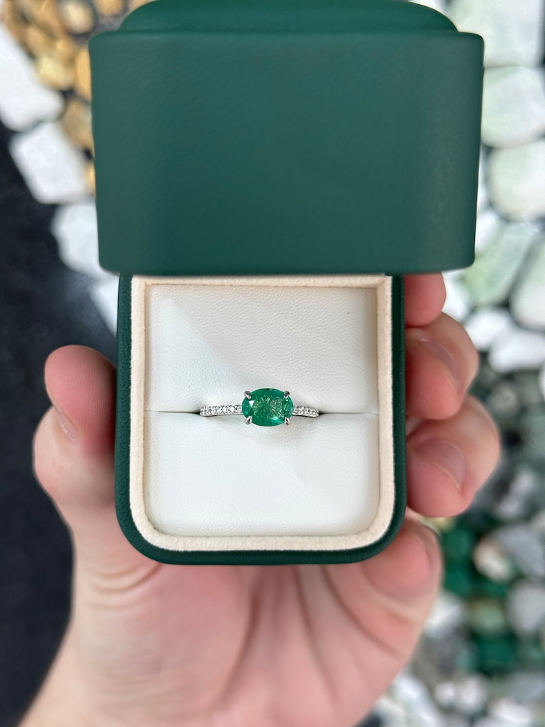 East to West Zambian Emerald and diamond accent engagement ring in 14K gold, featuring Colombian Emerald brand.