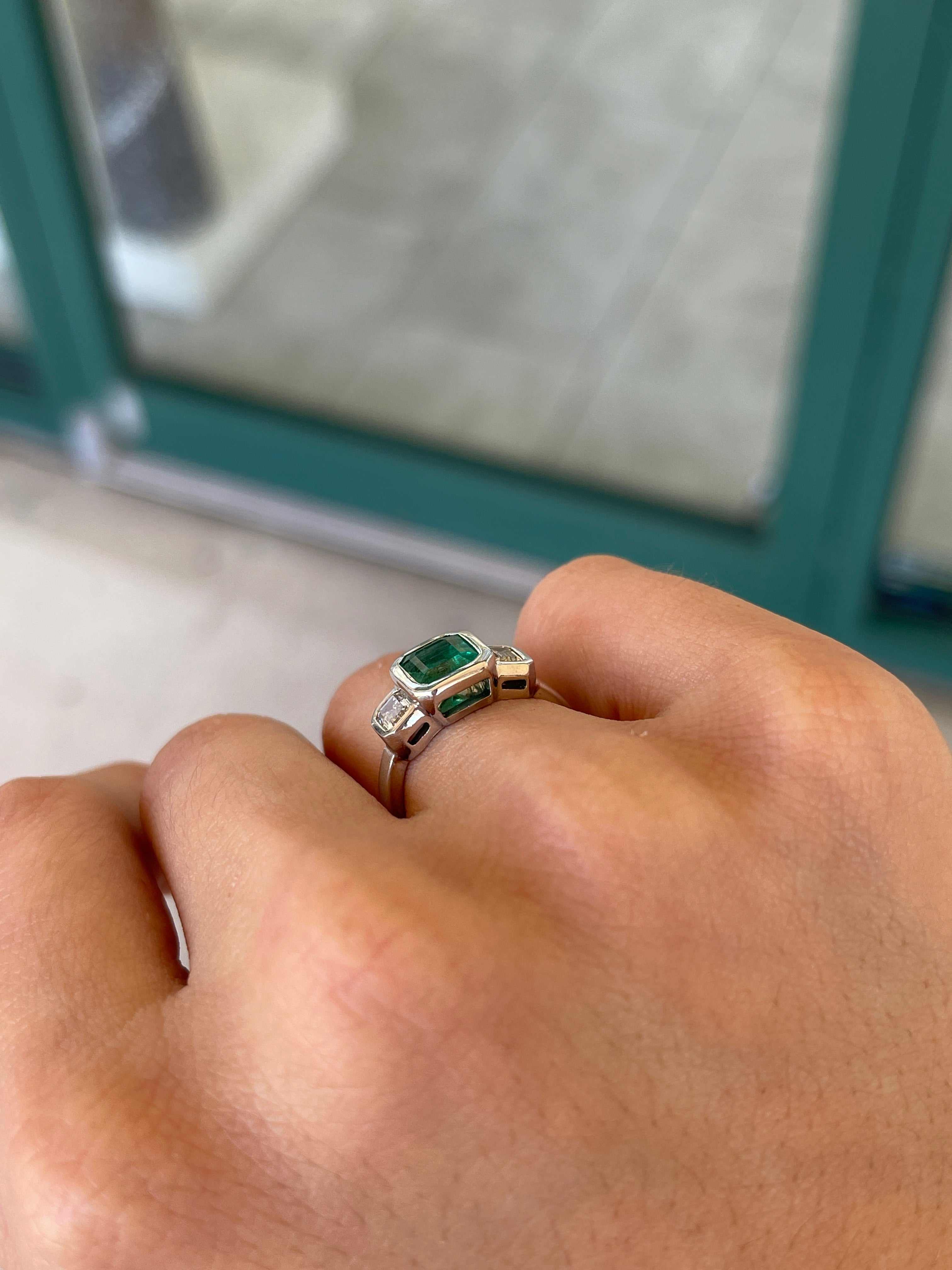 14K gold engagement ring featuring three natural emerald cut diamonds totaling 2.25 carats from Colombian Emerald.