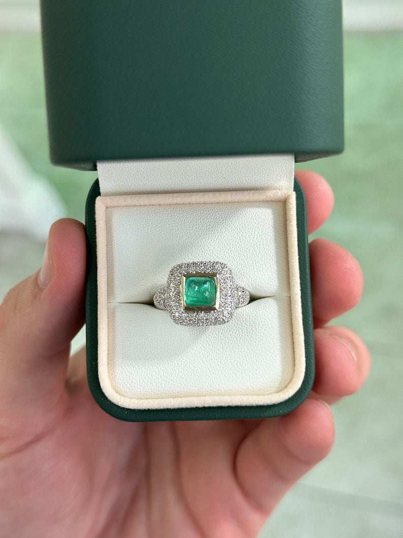Natural Colombian emerald cluster engagement ring with diamond accents in 14K gold, showcasing a sugarloaf cut emerald center.