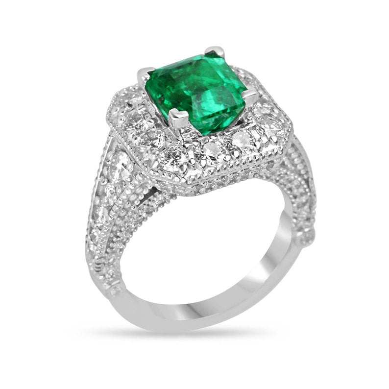 Colombian Emerald engagement ring with a 3.08tcw AAA vivid green emerald cut diamond halo in 14K gold