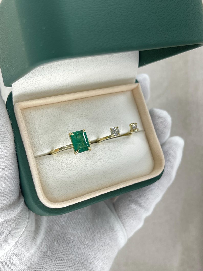 14K natural emerald and diamond three-stone engagement ring featuring convertible design, showcasing vibrant green emeralds and sparkling diamonds.