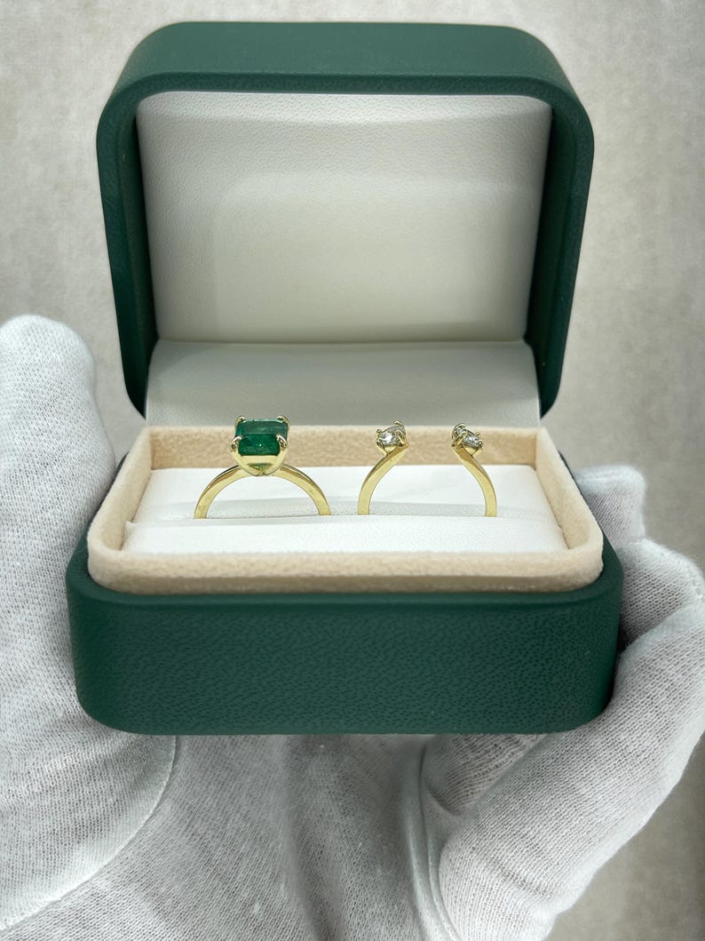 14K Colombian Emerald and diamond convertible engagement ring with three stones, featuring natural emeralds and sparkling diamonds.