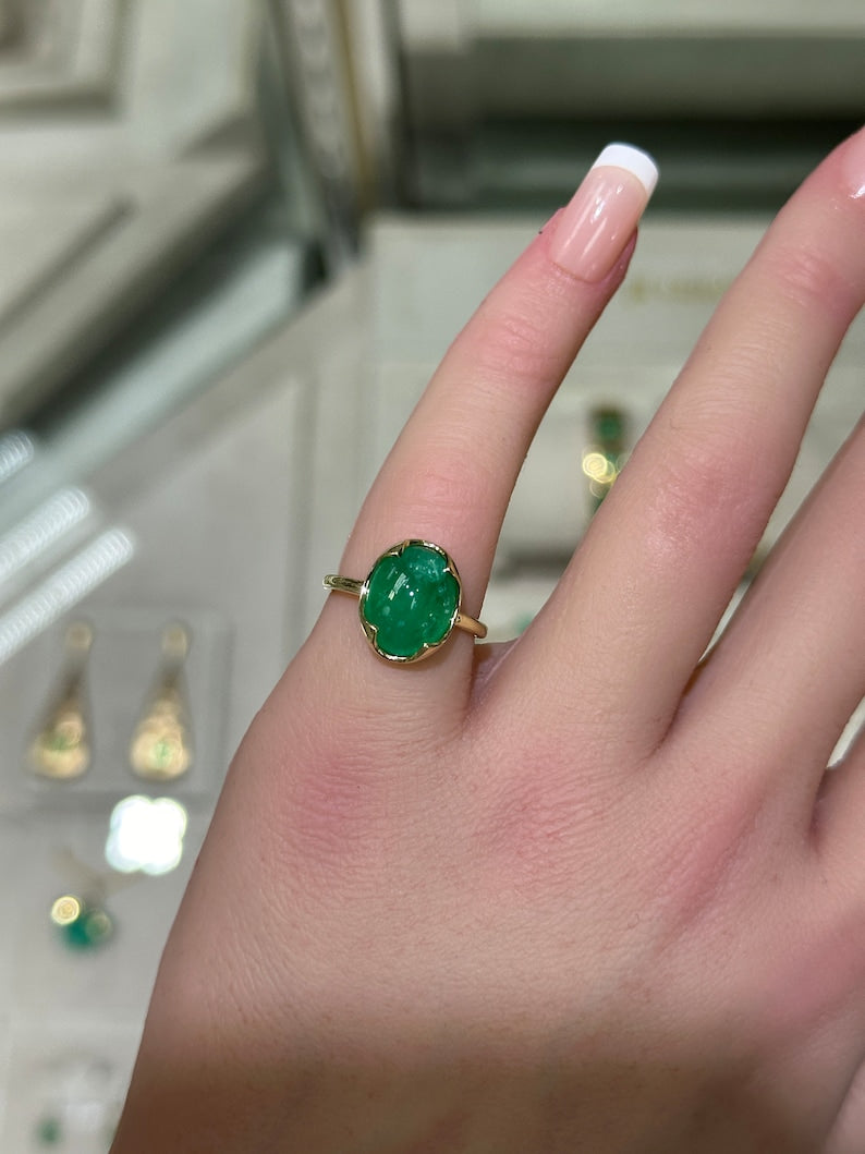 14K dark green dome oval cabochon emerald solitaire engagement ring featuring a 4.29ct Colombian emerald.