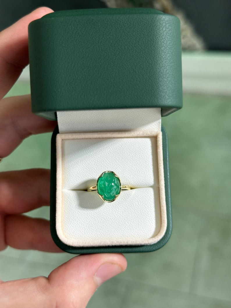14K dark green oval cabochon emerald solitaire engagement ring with 4.29ct Colombian emerald, displayed on a white background.