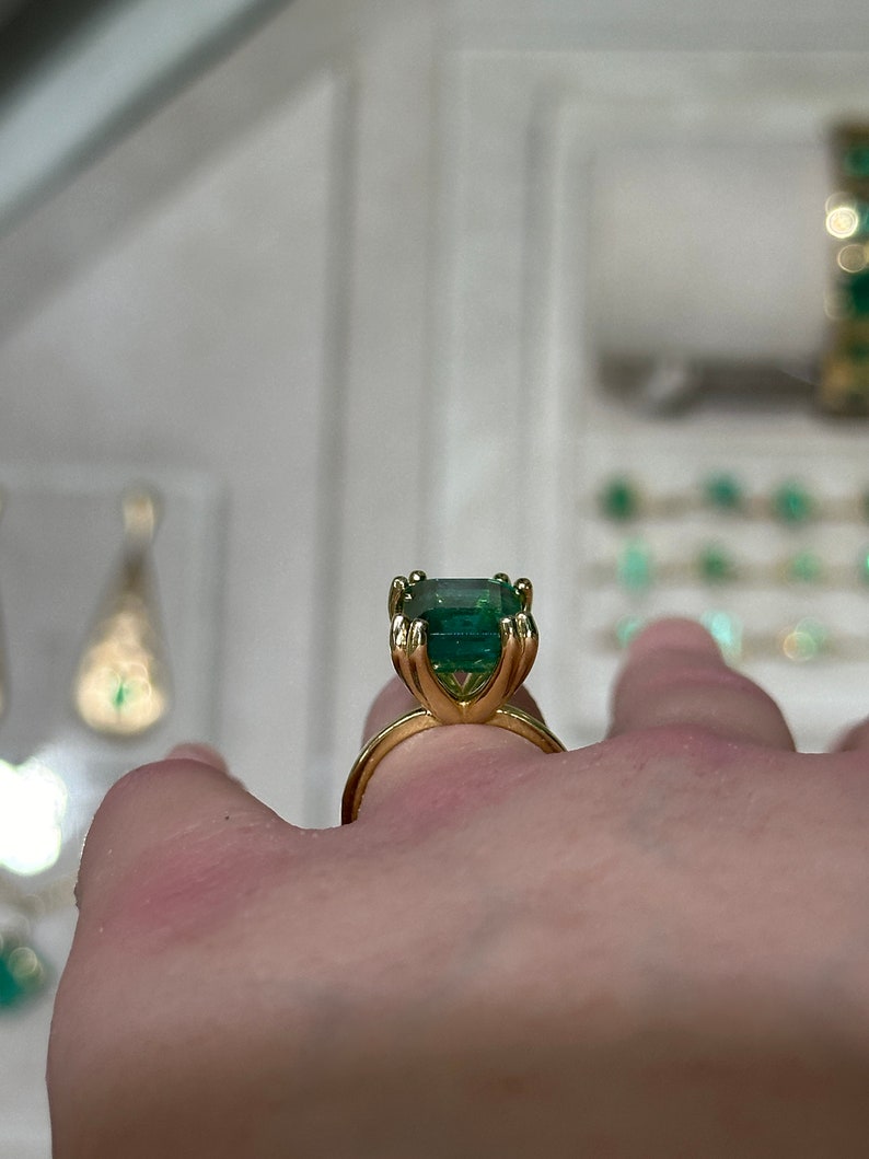 14K Colombian Emerald engagement ring with a 7.35ct emerald cut solitaire gemstone in chunky claw prongs