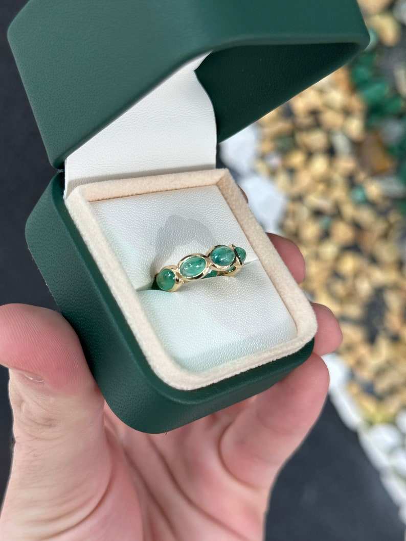Ladies Colombian Emerald wedding band with 3.60tcw east-to-west oval cabochon cut emeralds in 14K yellow gold, size 5.25