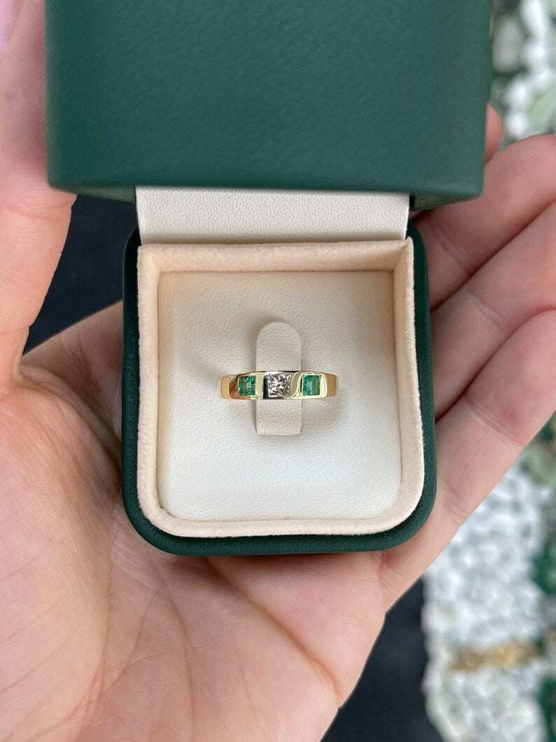 Ladies emerald ring featuring a 0.68 carat vivid green diamond and emerald princess cut band in 14K gold by Colombian Emerald.