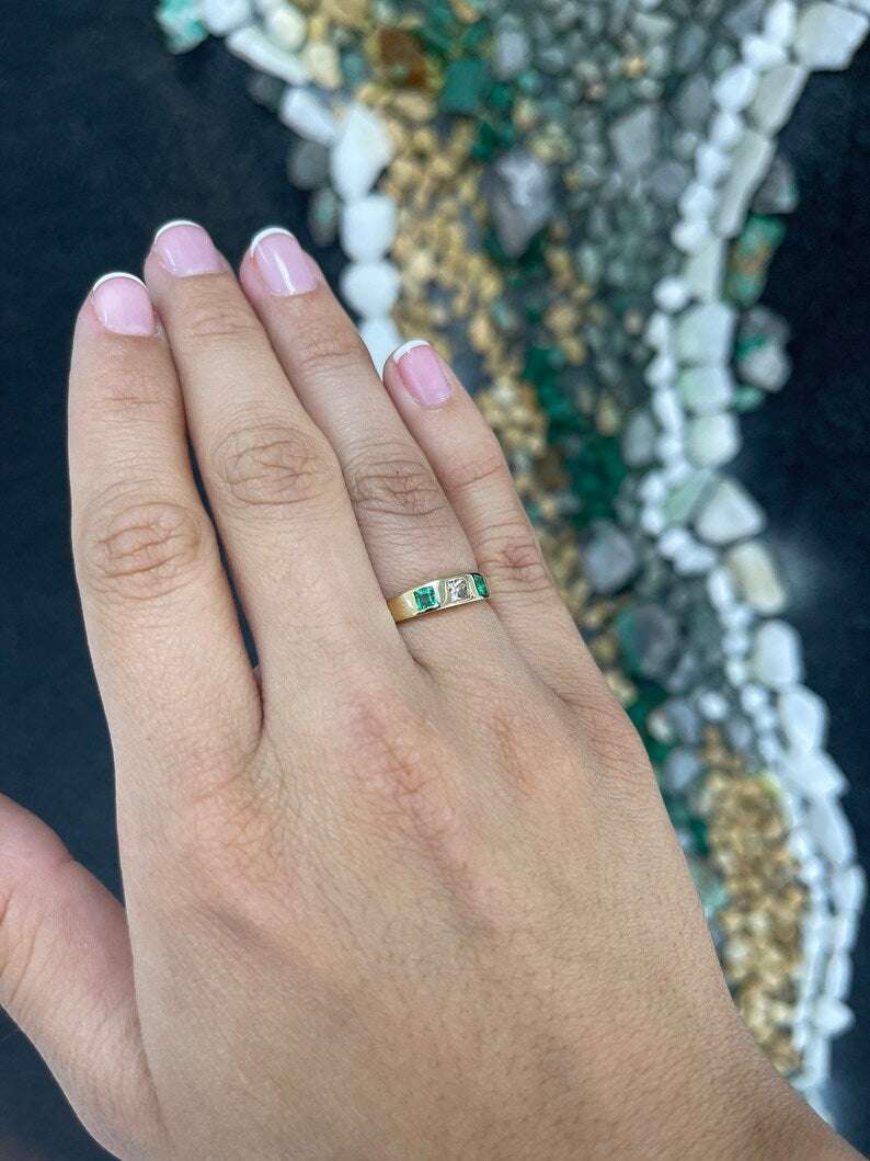 Ladies emerald ring featuring 0.68tcw vivid green diamond and emerald in a princess cut band, set in 14K Colombian Emerald jewelry.