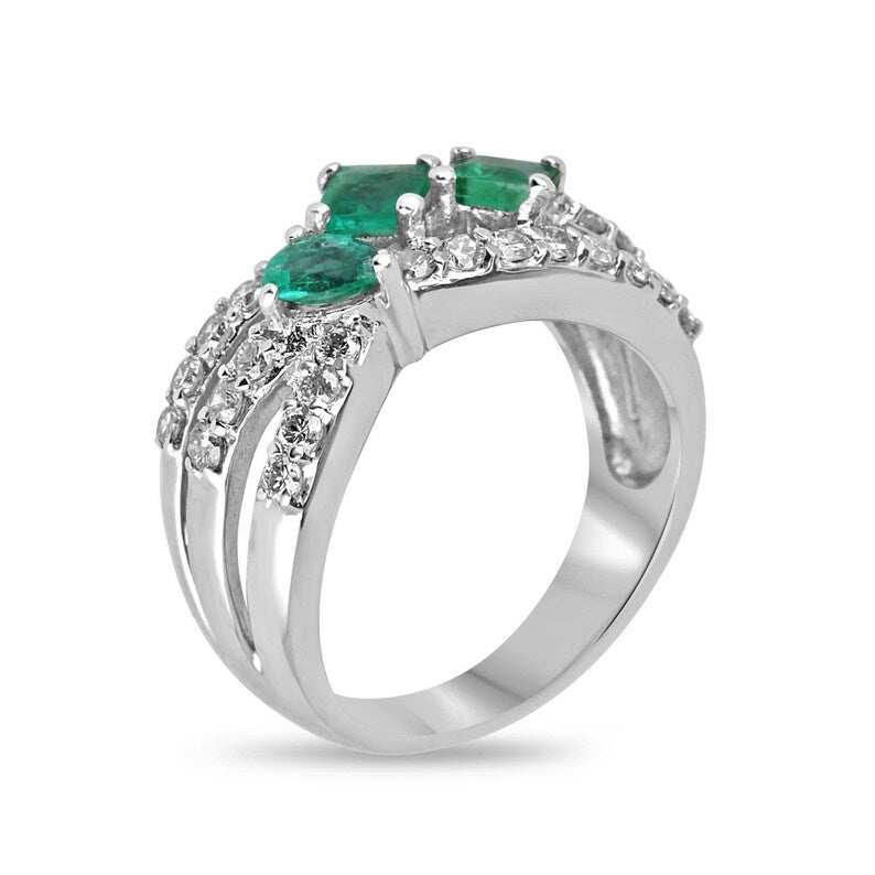 Ladies emerald ring featuring 1.20tcw natural emeralds, diamond accents, princess cut stones, set in 14K gold with pave shank.