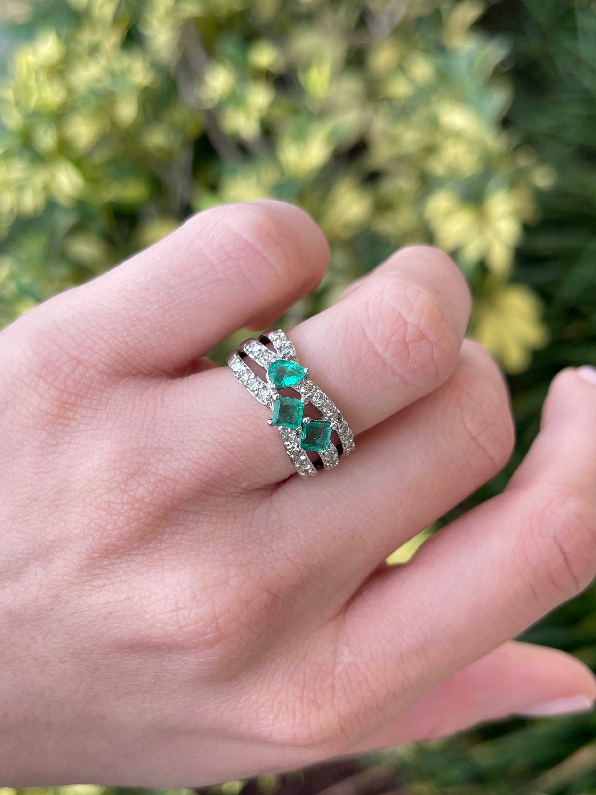 Ladies emerald ring with 1.20tcw natural emeralds and diamond accents in a 14K gold princess cut 3-stone pave design
