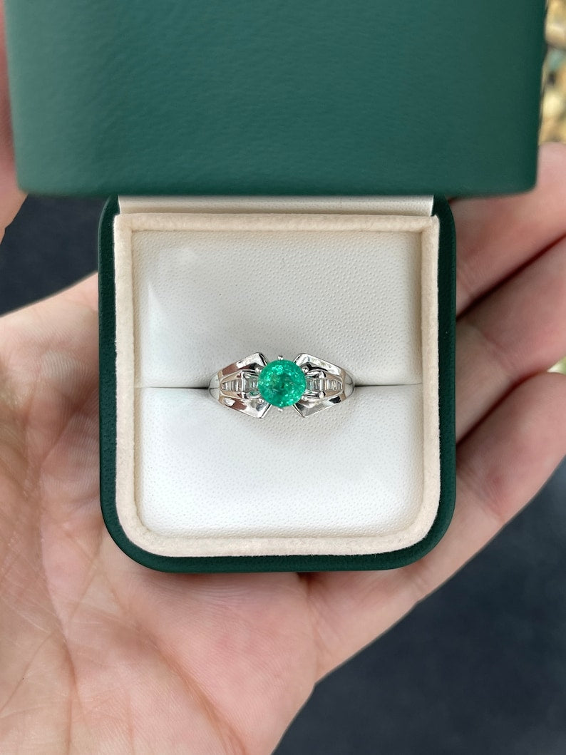 Colombian Emerald ladies ring with 1.25ctw white gold, round emerald center stone, tapered baguette diamond accents, 6-prong setting