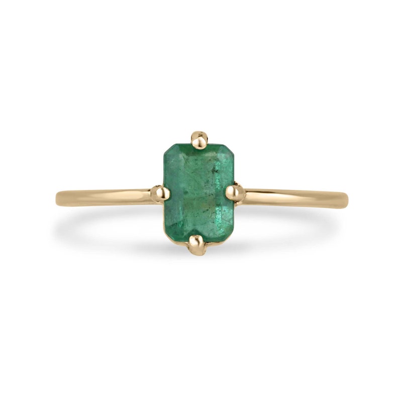 14K Colombian emerald ladies ring with a 0.70ct four-prong north-south solitaire setting on a delicate band