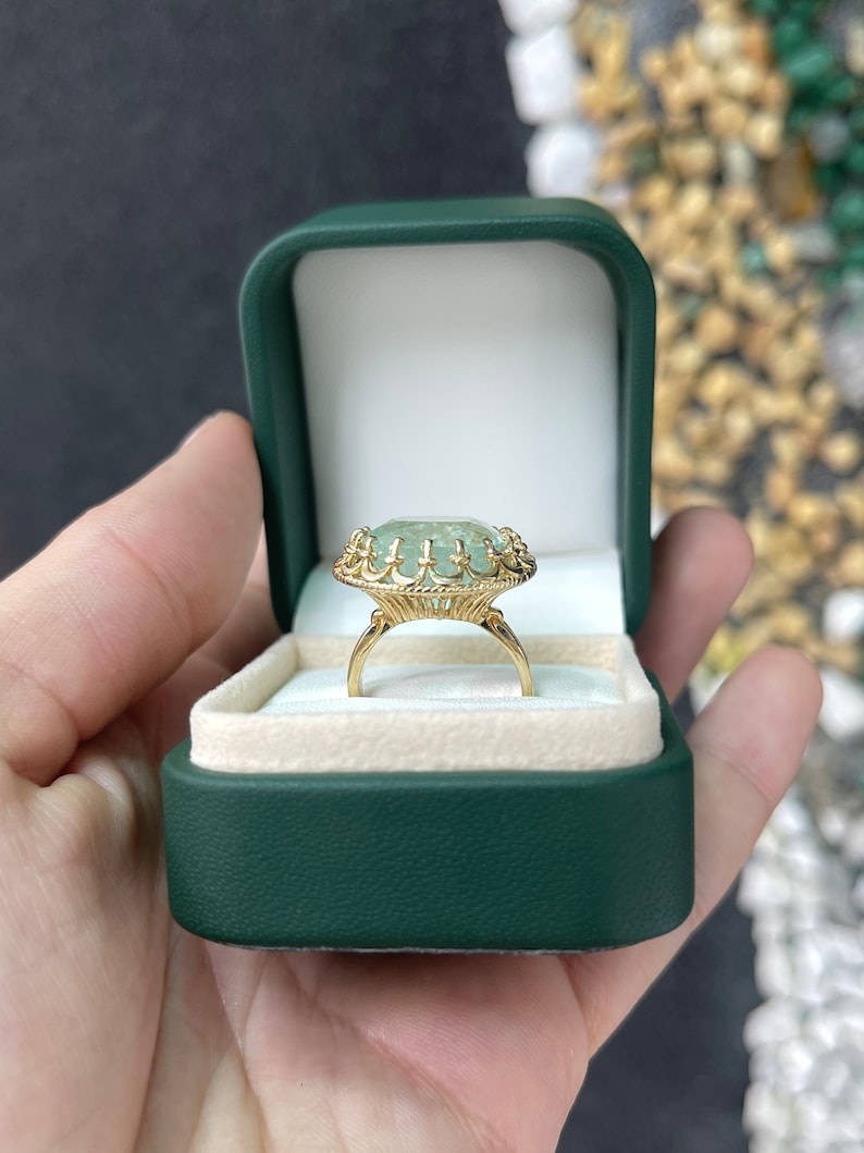 Large 16.75ct pale green cushion cut Colombian emerald lady's vintage-inspired 14K gold ring with antique style.