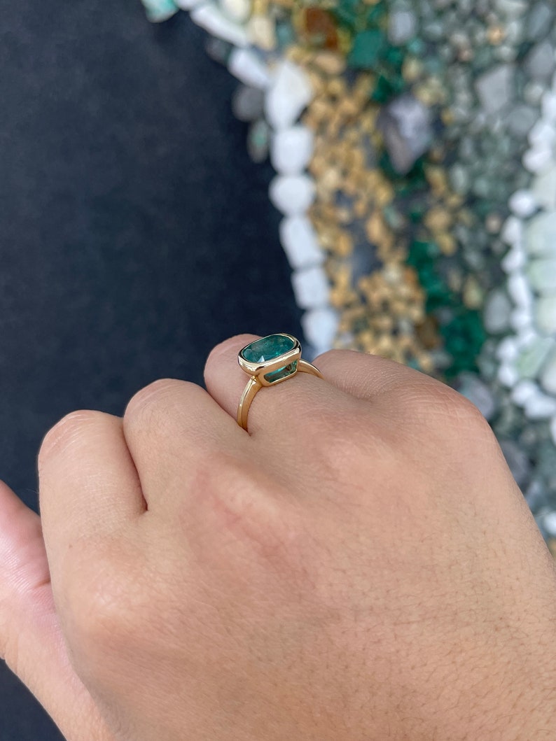 Deep ocean green 3.83ct cushion cut emerald engagement ring in 14K gold by Colombian Emerald, featuring a stunning elegance.