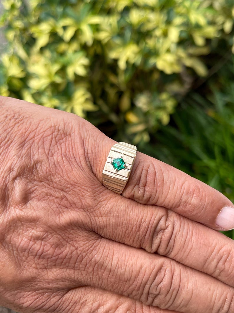 Men's 0.60ct 14K gold emerald cut pinky ring with rich green solitaire from Colombian Emerald.