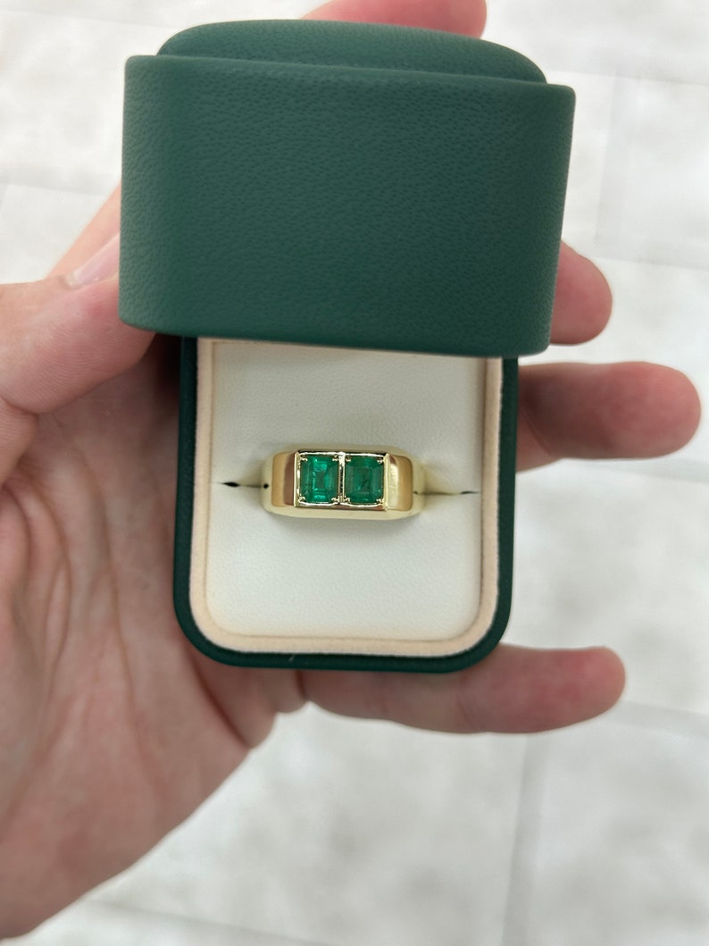 Double emerald duo men's ring with 14K gold bezel setting, featuring two vibrant Colombian emerald stones in a chunky unisex design.