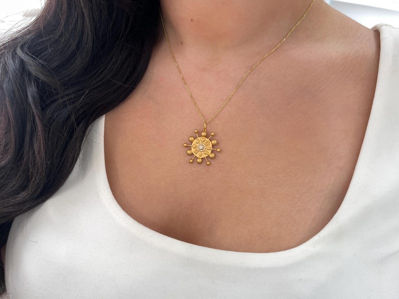 14K gold celestial pendant with 0.15tcw natural diamonds and Colombian emerald accents, elegant jewelry necklace.