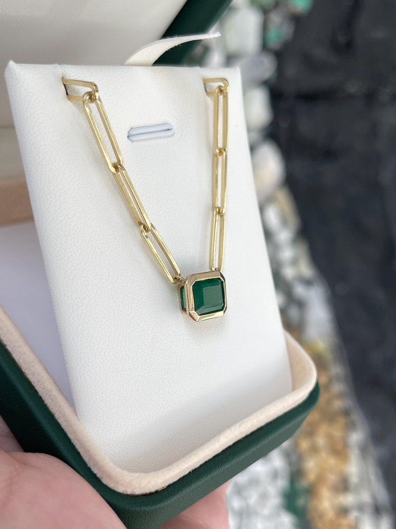 Dark green emerald paperclip stacking necklace featuring 2.58 carats of natural Colombian emeralds in 14K gold.