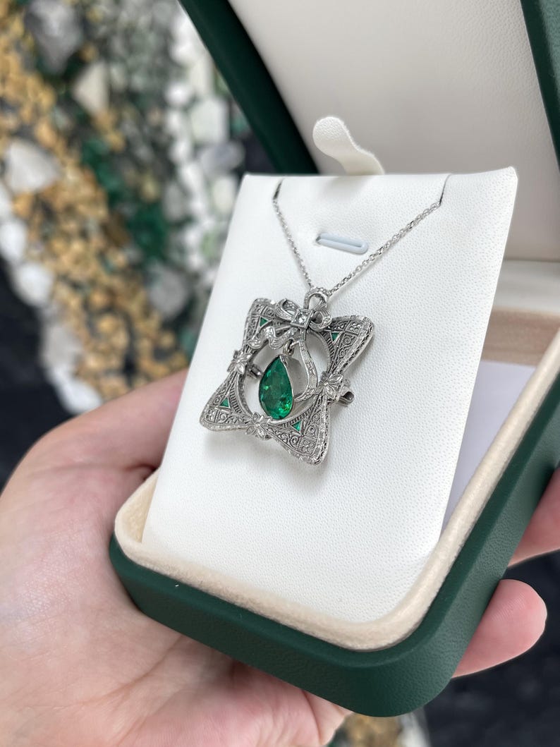 14K Colombian Emerald and diamond vintage pendant with pear-cut emerald and intricate design, perfect for necklaces and brooches.