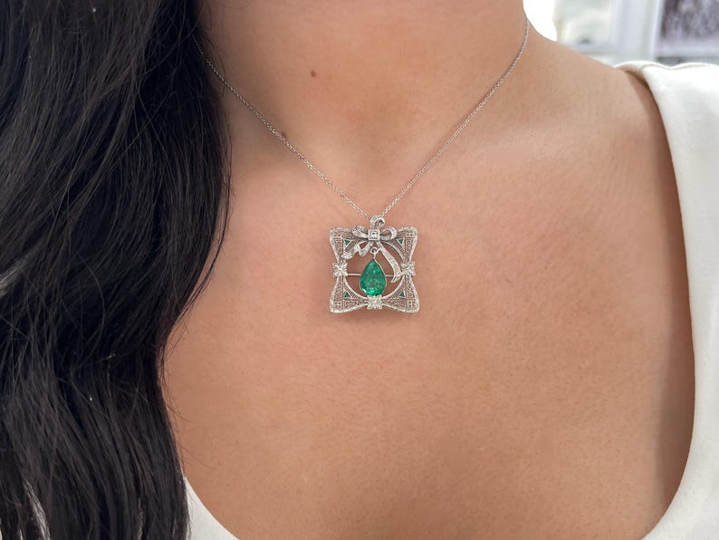 14K Colombian Emerald pendant with pear-cut emerald and diamond accents, vintage style, showcasing elegant jewelry craftsmanship.