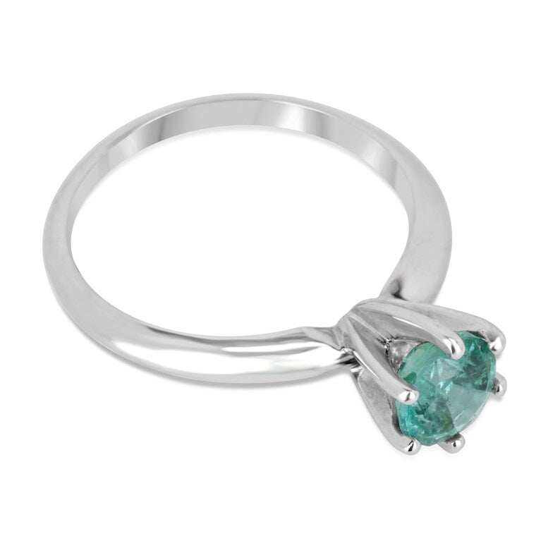 Colombian Emerald 0.80ct round cut ocean blue engagement ring with six prongs in 14K gold, featuring a stunning gemstone centerpiece.