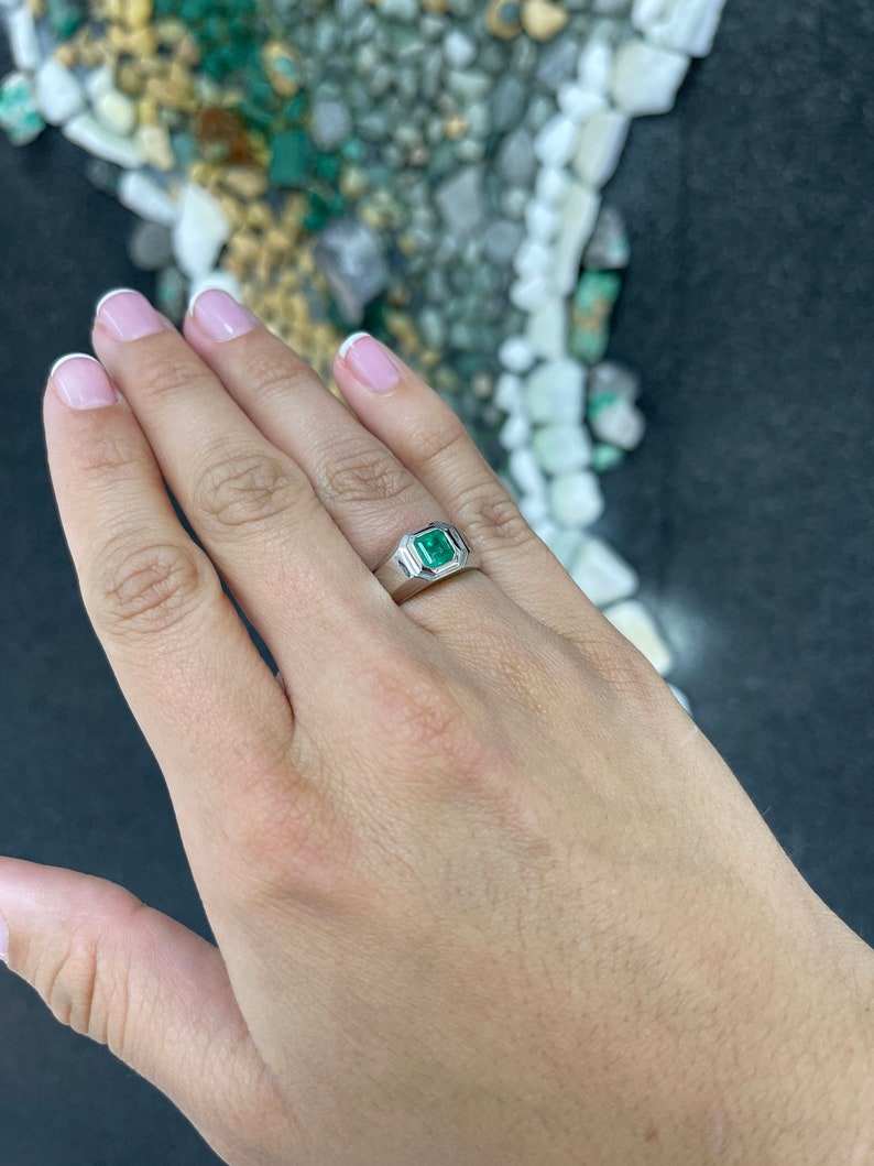 Men's silver ring with 0.90 carat vivid medium green emerald, featuring pink accents, from Colombian Emerald collection.