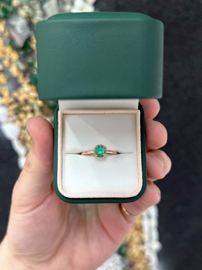 14K rose gold engagement ring with a 0.90ct round cut emerald solitaire, Colombian Emerald brand, right hand ring.