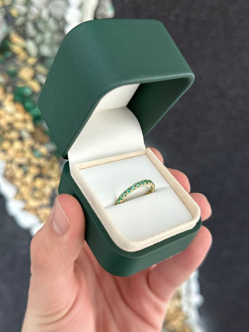 Medium dark green emerald half eternity ring with 0.90tcw round cut gemstones set in 14K gold by Colombian Emerald.