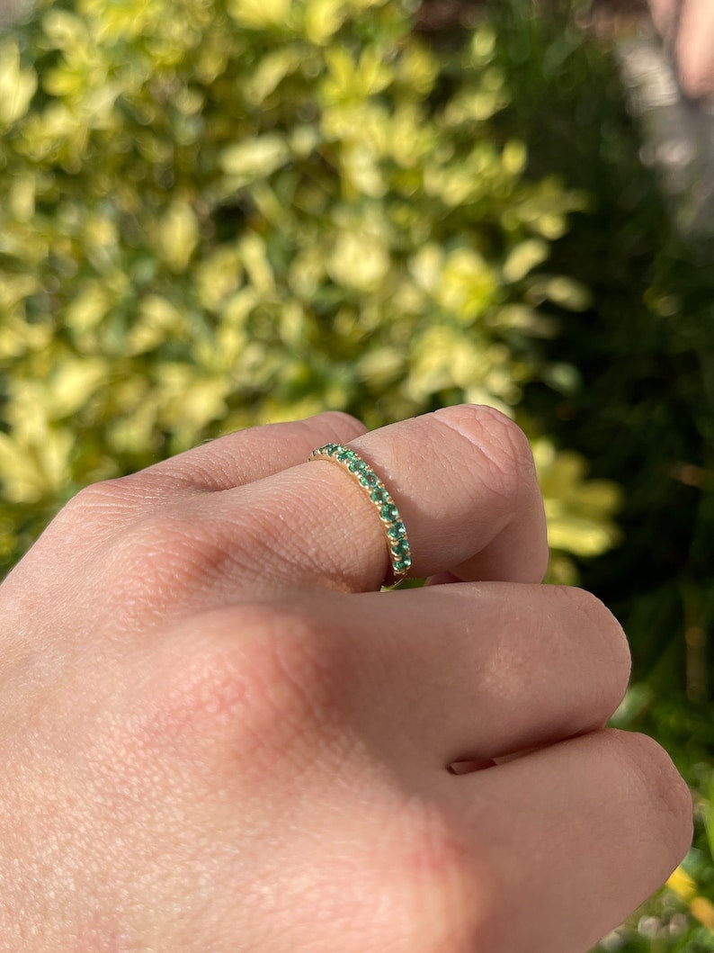 Medium dark green round cut emerald half eternity ring in 14K gold with 0.90tcw Colombian Emerald brand jewelry.