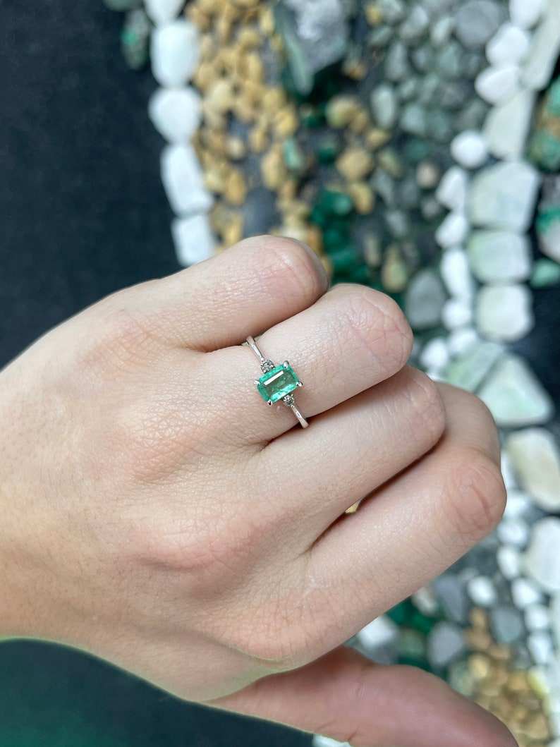 Sterling silver 3-stone ring with three natural medium green emerald cut brilliant round diamonds, 0.98tcw from Colombian Emerald.