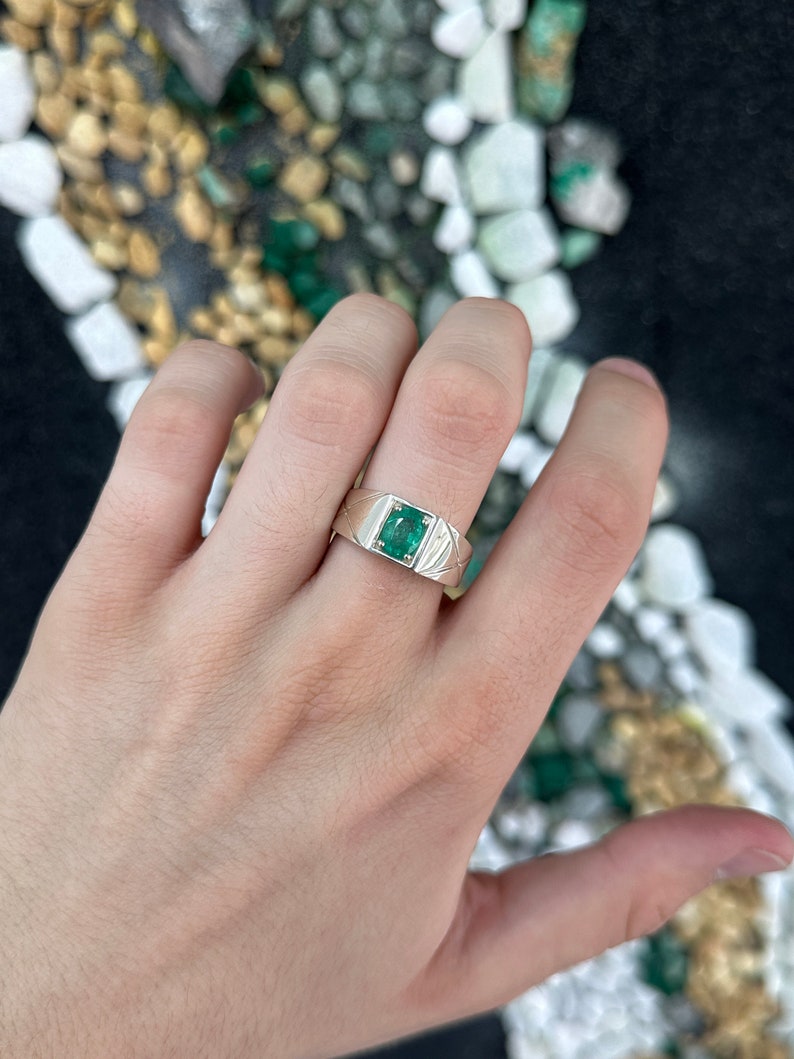 Sterling silver men's ring featuring a 1.13 carat lush green oval cut solitaire emerald from Colombian Emerald.