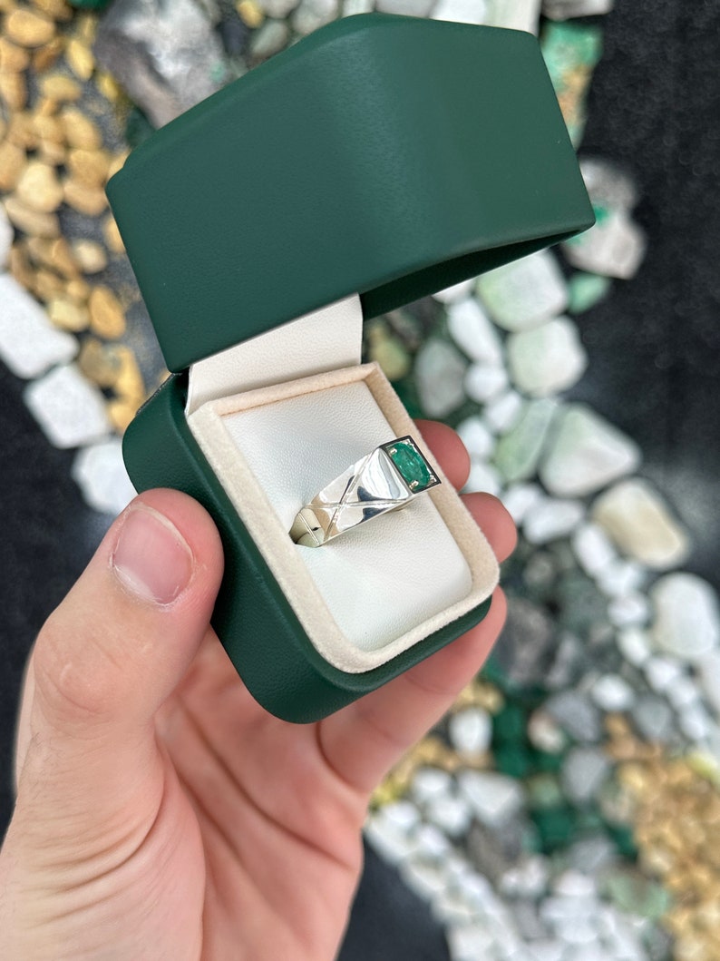 Sterling silver men's ring featuring a 1.13 carat lush green oval-cut solitaire emerald from Colombian Emerald.