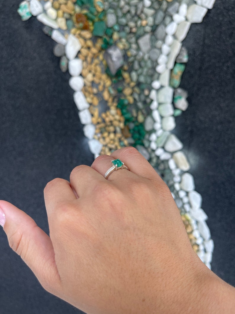Sterling silver 4-prong ring featuring a 1.30ct natural Asscher cut bluish green emerald from Colombian Emerald.
