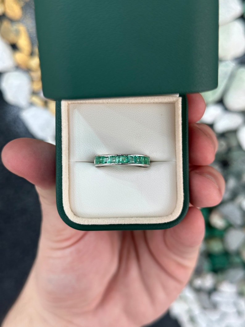 14K white gold unisex wedding band with 1.35tcw medium green princess cut emerald from Colombian Emerald.